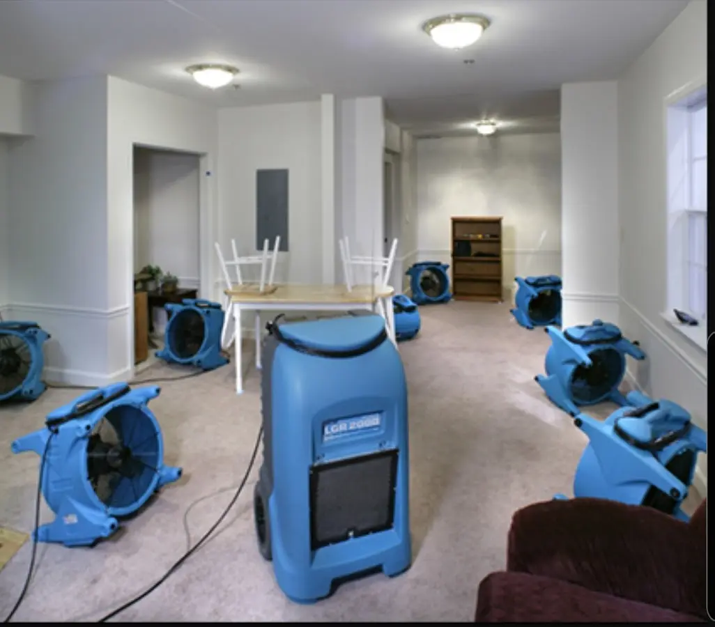 Air movers and dehumidifier setup for Water Damage Restoration in Newbury